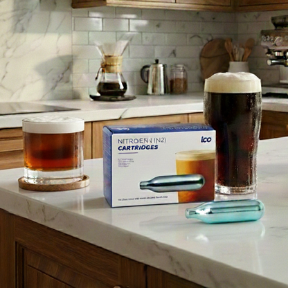 Nitrogen cartridges and glasses of beer on a kitchen counter. Cold brew coffee. Nitrus coffee. Nitro Coffee. 
