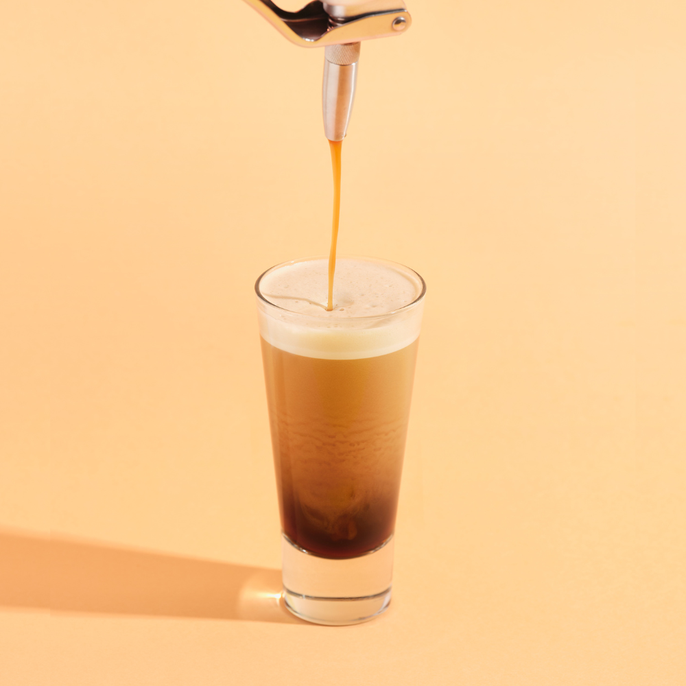 Nitro Kafo nitro cold brew coffee maker dispensing creamy stout coffee. No cream no dairy no sugar