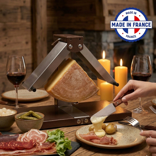 Traditional quarter round Swiss raclette cheese melting machine in use. Made in France. Melted cheese and meat and potatoes. Fine dining. Switzerland, Alps. 