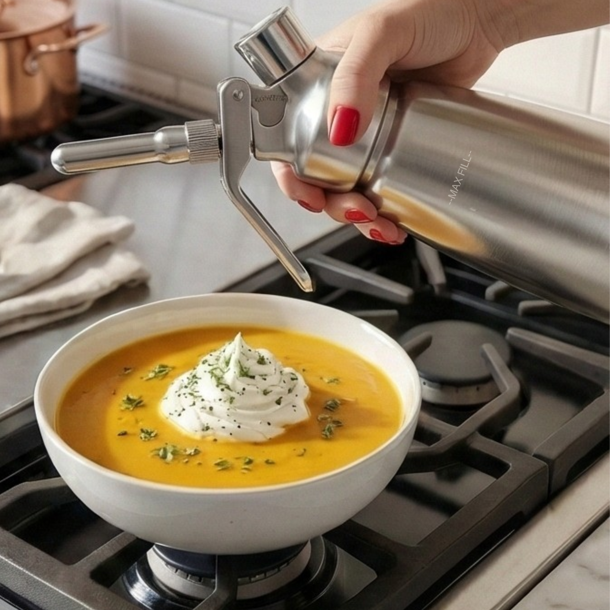 Professional 1-pint stainless steel whipped cream maker and culinary dispenser. Culinary foam espuma savory on soup. 